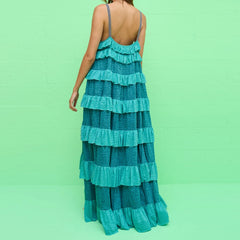 A close-up of the tiered ruffle detail on the dress.