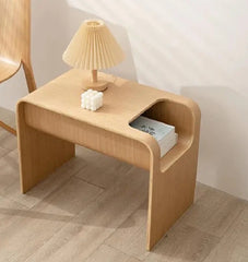 Triangle edge side table in pure wood styled next to sofa and window