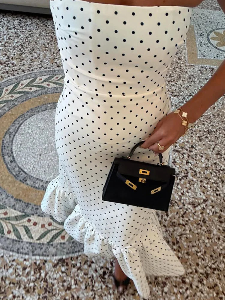 close view of straight strapless bodice on white dotted maxi dress