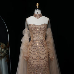Elegant beaded gown on a mannequin with a dark background