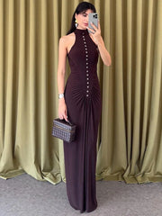 A full-length shot of a turtleneck sleeveless club dress, highlighting its elegant silhouette.