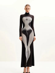 Model wearing a slim fit mesh maxi dress in black and gray with ankle length hem on a white background
