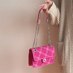 Vibrant pink textured tweed handbag with soft structure