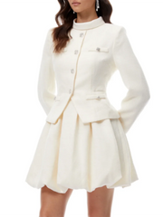 Tailored mini dress showing refined A-line structure and elegant evening silhouette