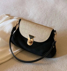 Two-tone black and beige vintage crossbody bag with gold clasp
