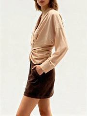 Side view highlighting the folded knot detail and soft drape through the neckline