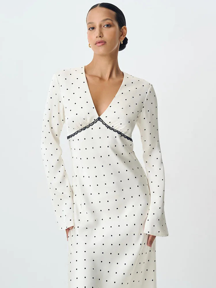 A full-length shot of a long-sleeve V-neck party dress, highlighting its bodycon silhouette.