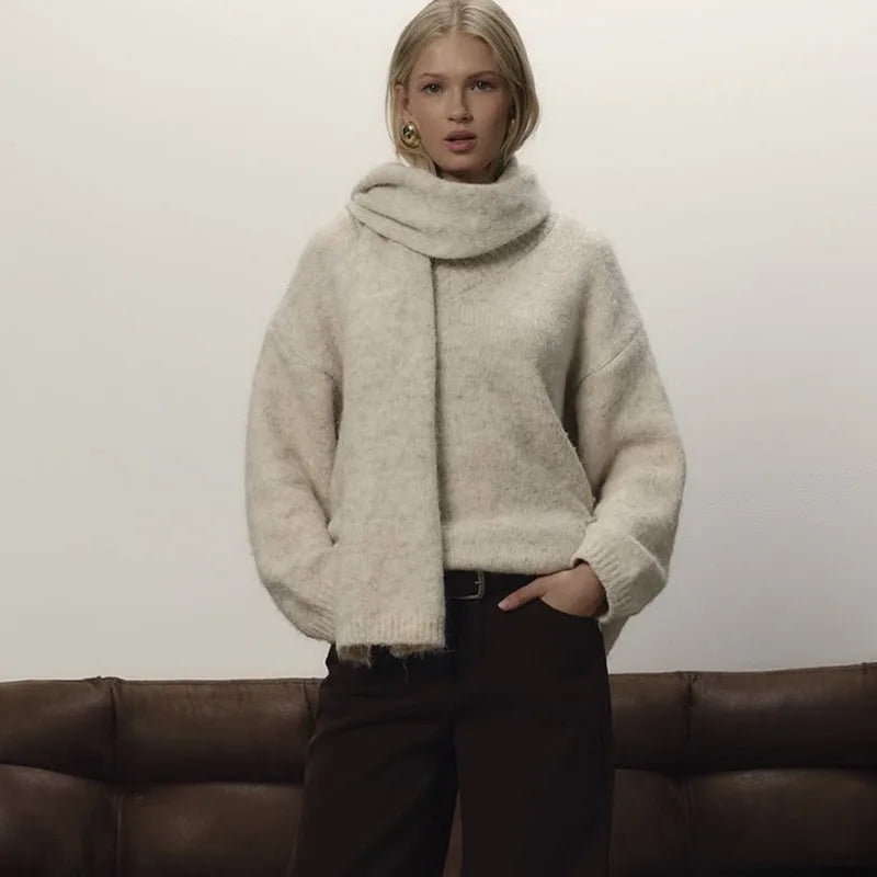 Close-up of the sweater neckline showing the integrated scarf drape and soft knit texture.