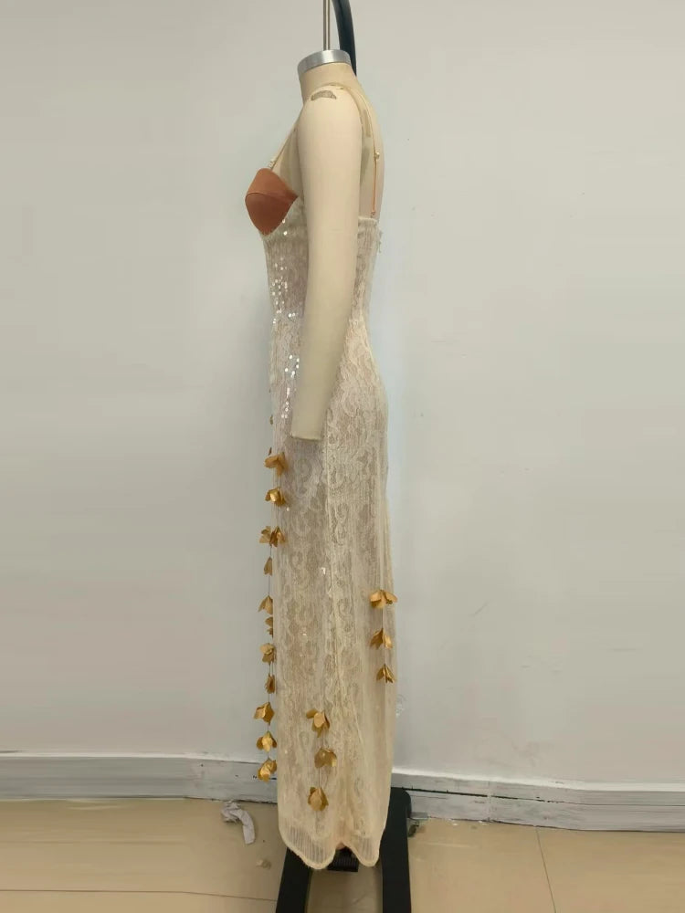 A close-up of the V-neck and sequin lace detail on the dress.