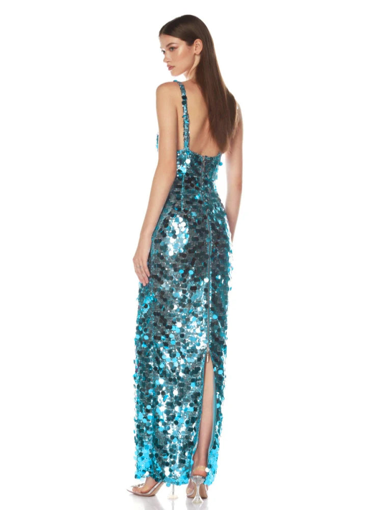 Side view of the blue sequin dress capturing the smooth drape and sculpted fit.