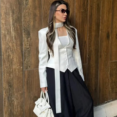 The front view of a single-breasted V-neck blazer, highlighting its clean cut.