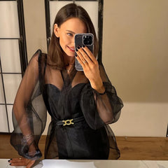 Lightweight woven black top styled with tailored trousers