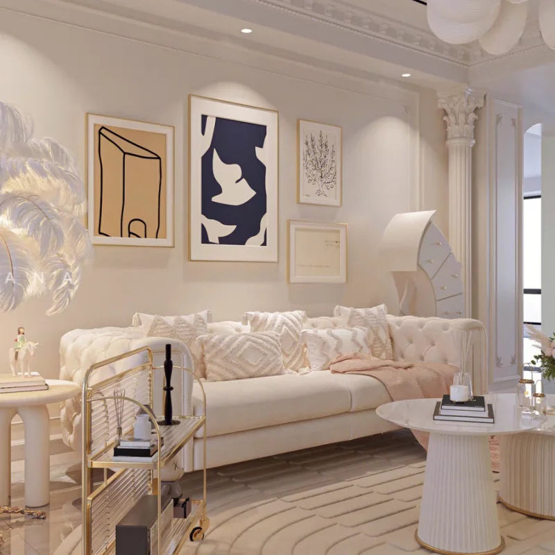 Modern living room with a beige sofa, decorative pillows, and abstract art on the wall.