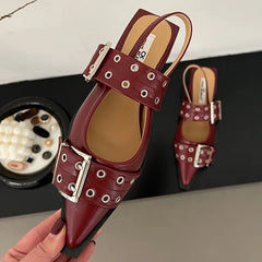 Red buckle strap mules styled with workwear