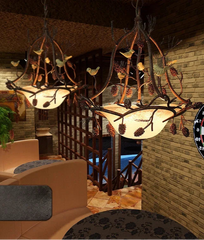 Vintage bird and pinecone pendant lamp ideal for cafes and eclectic spaces
