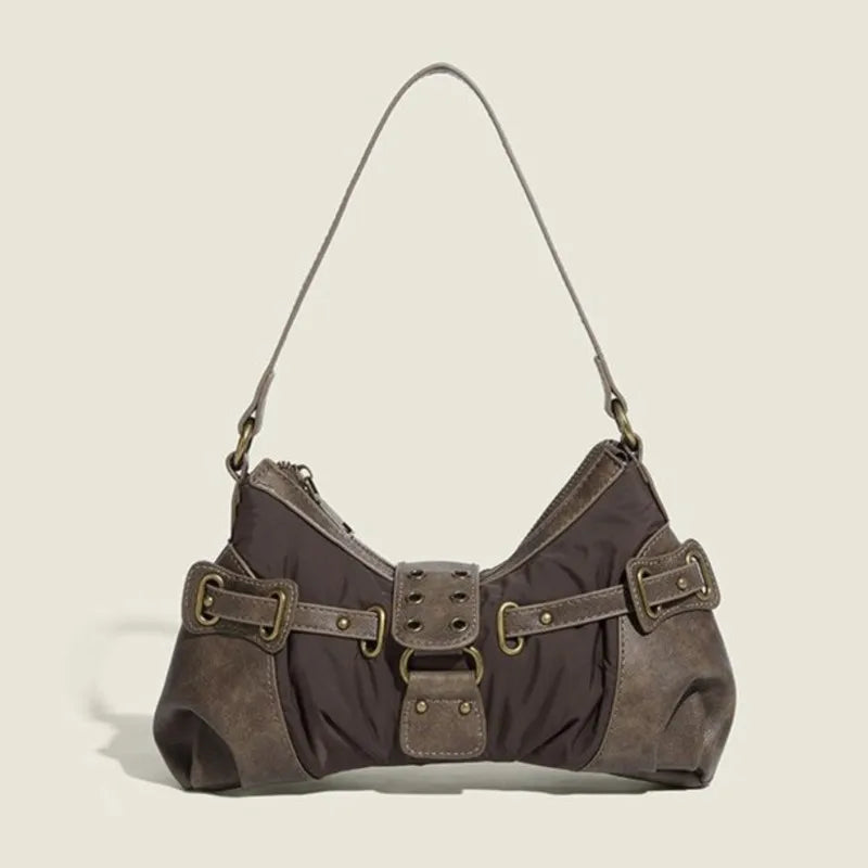 Brown Y2K-style shoulder bag with decorative buckles on beige background