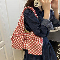 Red plaid bow handbag styled for spring and summer outfits