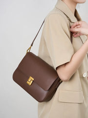 Small leather crossbody bag with flap front and lock hardware