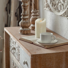 “White rustic storage cabinet styled in hallway with vintage decor”