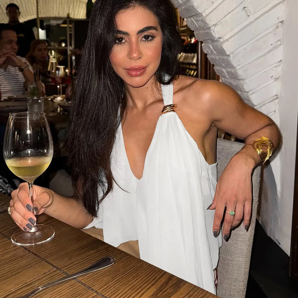 Full look captures the flowing hem movement and relaxed silhouette, creating an elevated summer outfit for city afternoons and dinners.