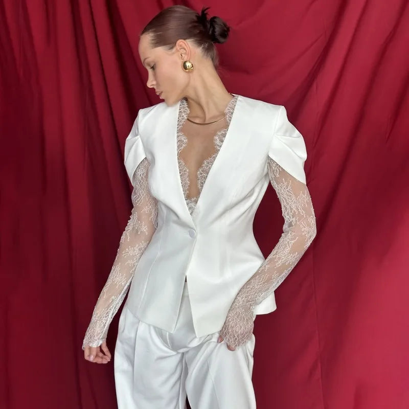 White tailored blazer with sheer lace sleeves and notched lapel