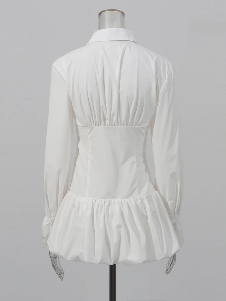 Sculptural white dress with voluminous hem