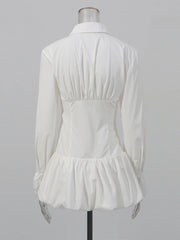 Sculptural white dress with voluminous hem