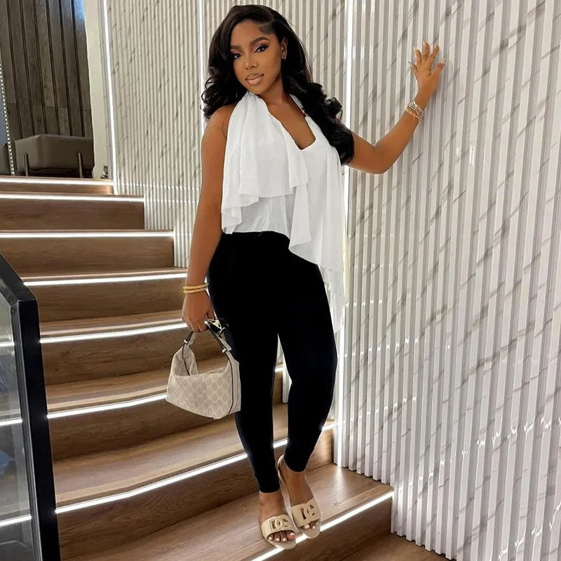 Close-up focuses on the halter neckline hardware and mesh texture, showing the soft layering and clean finish at the chest.