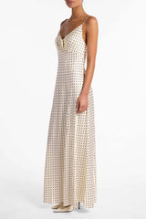 Side profile showing body-skimming sheath silhouette and fluid hem