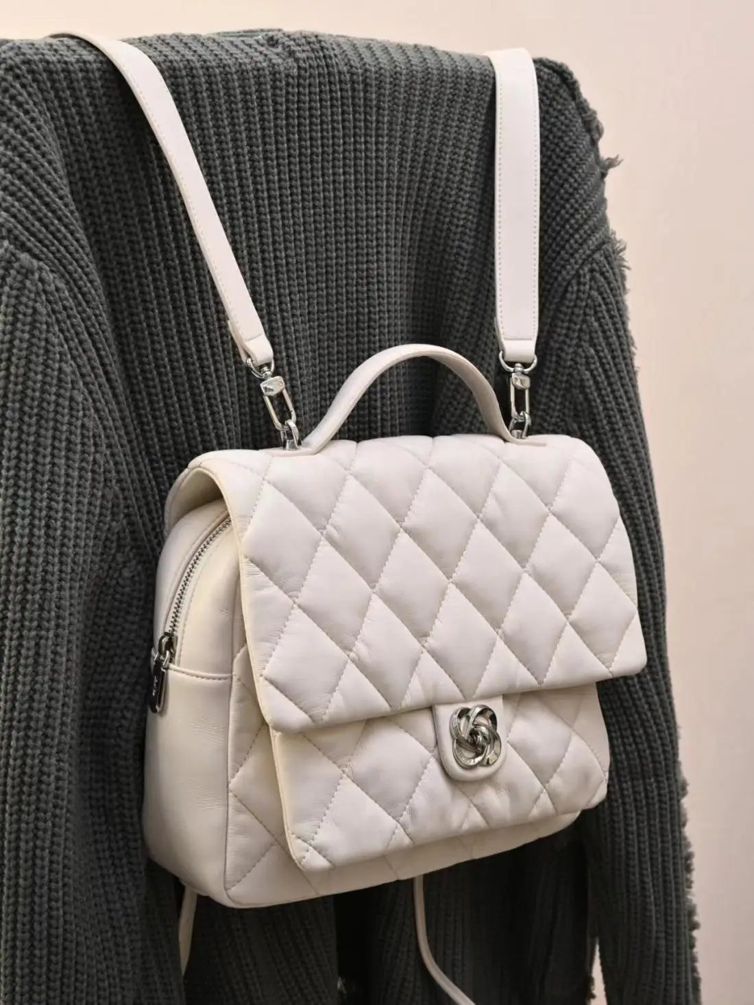 White quilted mini backpack with silver clasp