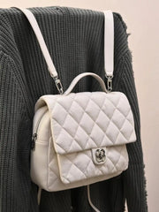 White quilted mini backpack with silver clasp