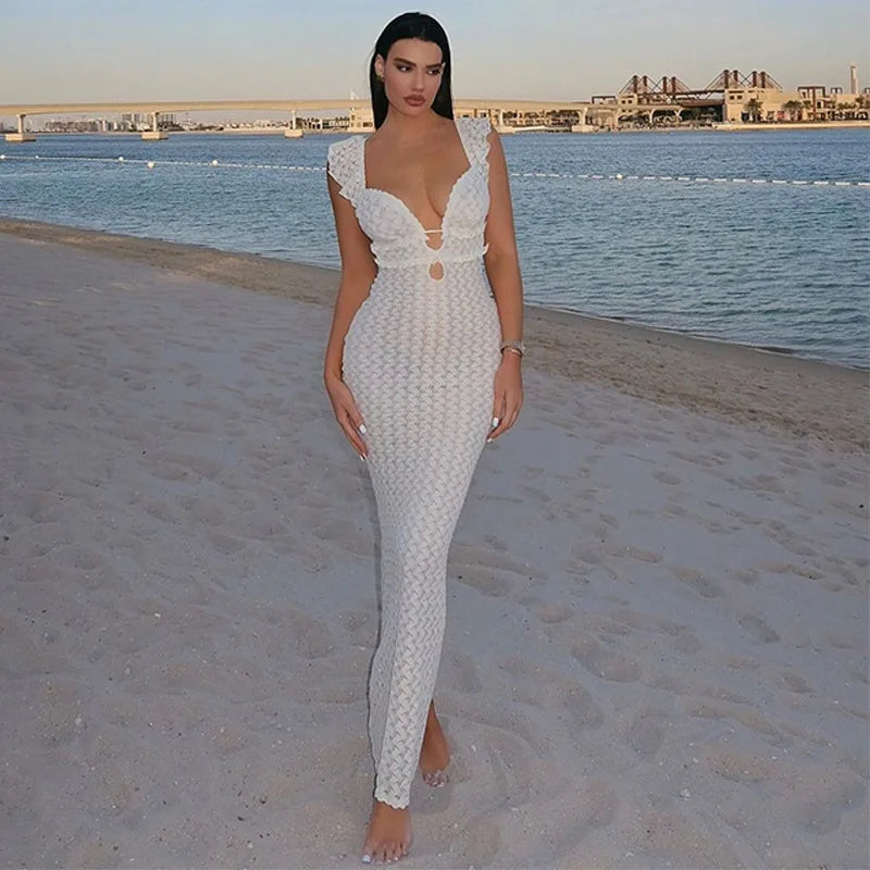 This image features a sleeveless, long ankle-length dress designed with a flattering V-neck and an open back, highlighted by ruffled straps. The dress is crafted from a blend of polyester and spandex, offering a high stretch, form-fitting silhouette that combines style and comfort.