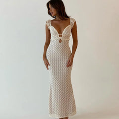 Women in a ruffled strap V-Neck Open Back Sleeveless Long Dress in a white background.