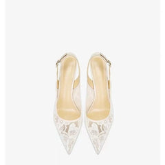 Pair of white lace high-heeled shoes on a white background