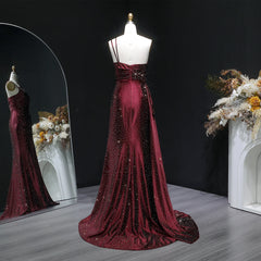 Backless detail on one-shoulder satin prom gown with sweep train