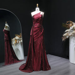 One-shoulder draped satin mermaid prom gown with side slit on mannequin