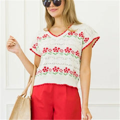 A front view of a women's casual V-neck top, highlighting the comfortable silhouette.