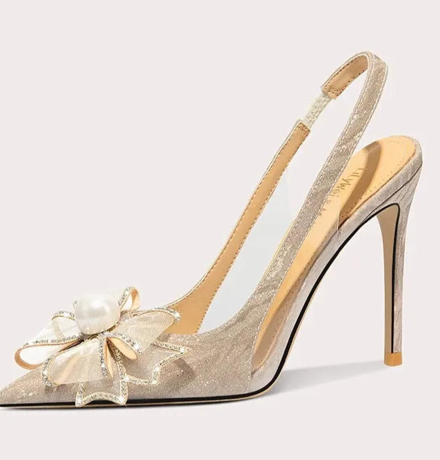 A full-length shot of women's wedding shoes, styled with a formal outfit.