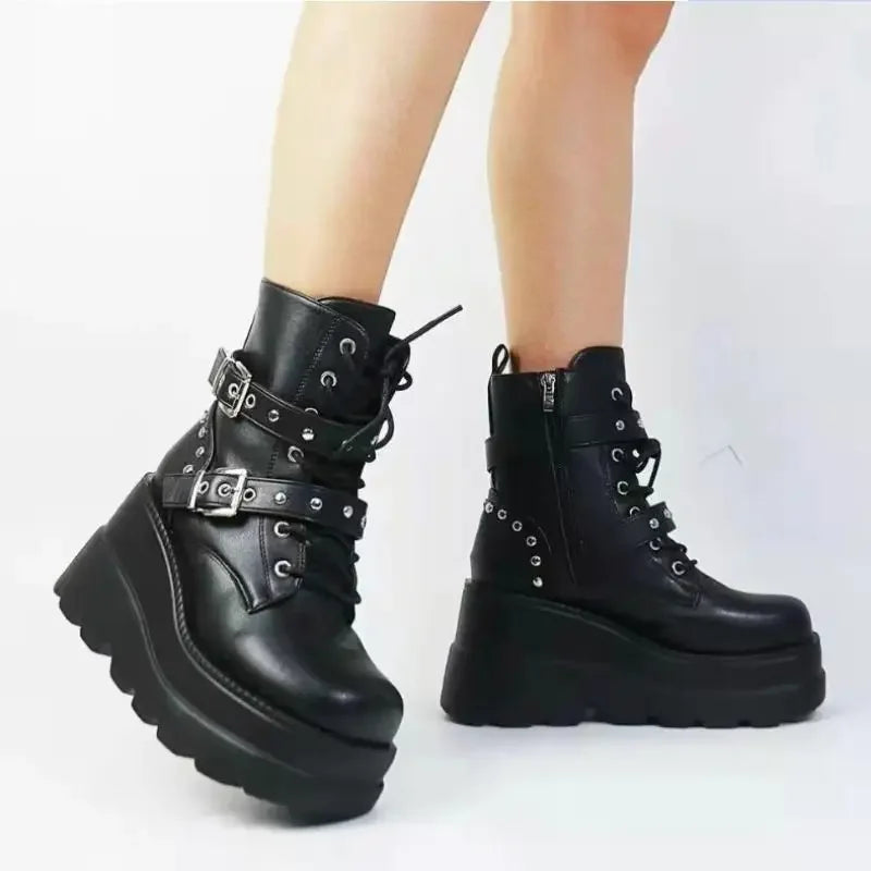 Side angle of gothic wedge heel boots with zip closure
