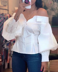 Women’s chic lantern sleeve top styled with jeans