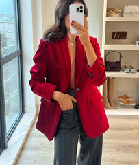 Tailored red blazer styled with light-wash jeans