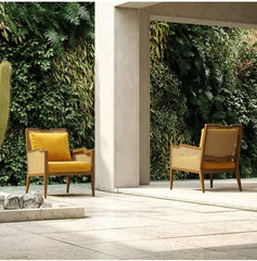 Natural wicker dining chair with cushioned seat and back