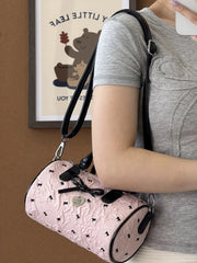 Vintage-inspired pink crossbody bowling bag
