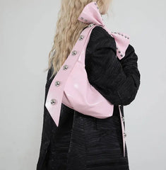Vintage-inspired Y2K hobo bag in pastel pink with decorative bow