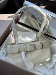 Leather-look moto underarm bag with minimalist shape
