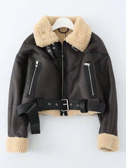 Close-up of an adjustable belt on a faux leather jacket with belt.