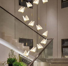 Silver artistic butterfly hanging lamp illuminating cozy living room, staircase,  for the Living Dining Room. 