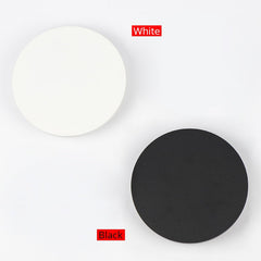 A circular acrylic LED wall-mounted light with a touch switch, black iron  and acrylic body black and white.