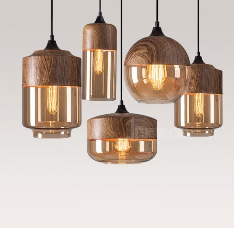 A set of modern LED pendant wood glass hanging lamps with a polished copper finish and a wood grain texture.