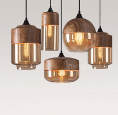 A set of modern LED pendant wood glass hanging lamps with a polished copper finish and a wood grain texture.